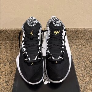 Jordan Zion 1 Black and White Athletic Shoes with Gold Accents